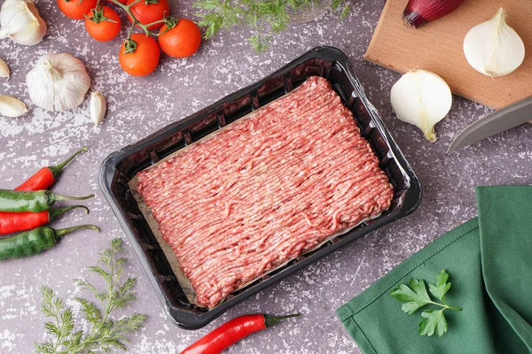 Plastic Package Fresh Minced Meat Vegetables Grey Grunge Background — Stock Photo, Image