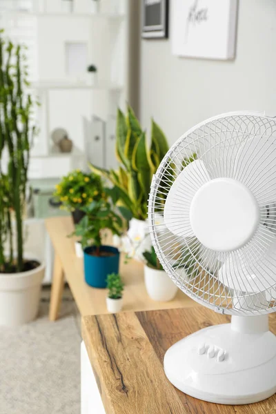 stock image Modern electric fan on table in living room