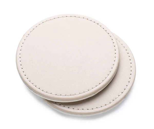 Leather drink coasters isolated on white background