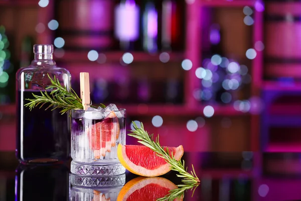 Glass Purple Gin Tonic Bottle Grapefruit Rosemary Table Bar Blurred — Stock Photo, Image