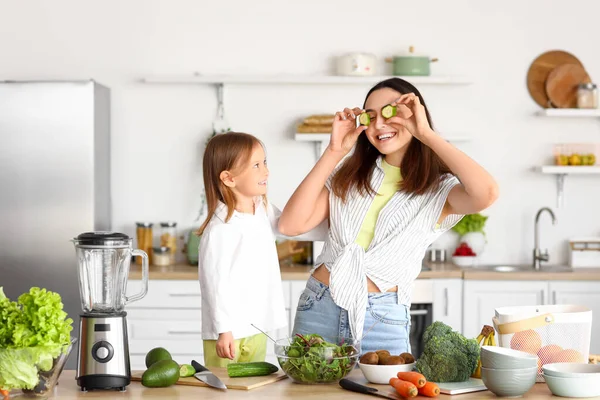 Little Girl Her Mother Cucumber Slices Having Fun Kitchen — Stock Photo, Image