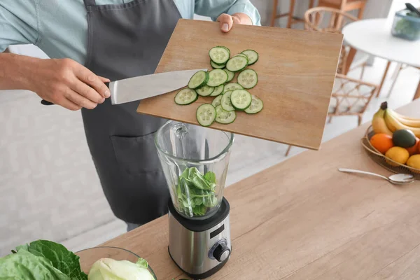 Mature Man Putting Cucumber Slices Blender Kitchen Closeup — Stock Photo, Image