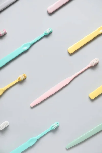 Plastic Toothbrushes Grey Background — Stock Photo, Image