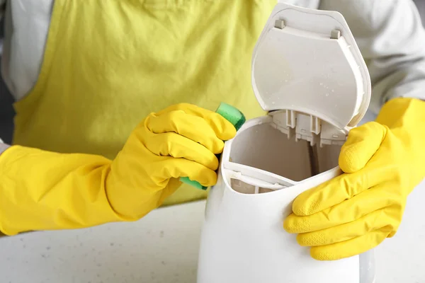 Woman Yellow Gloves Cleaning Electric Kettle White Table — Stock Photo, Image