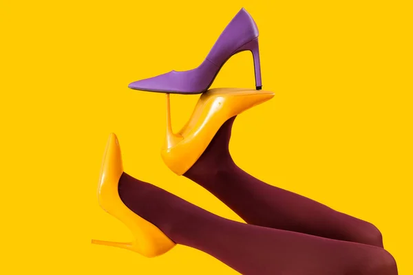 Female Legs Black Tights High Heels Yellow Background — Stock Photo, Image