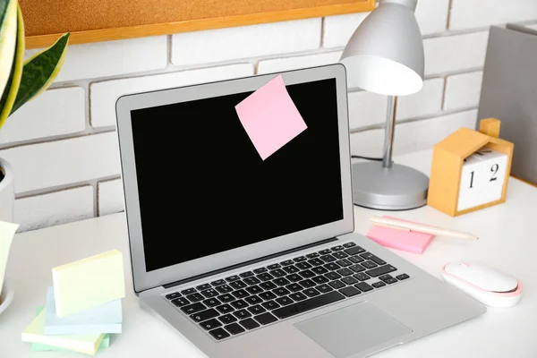 stock image Laptop with sticky notes on white table