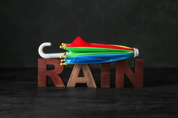Mini Paraguas Palabra Rain Sobre Fondo Negro — Foto de Stock