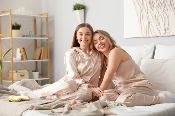 Young Sisters Hugging Bedroom — Stock Photo, Image