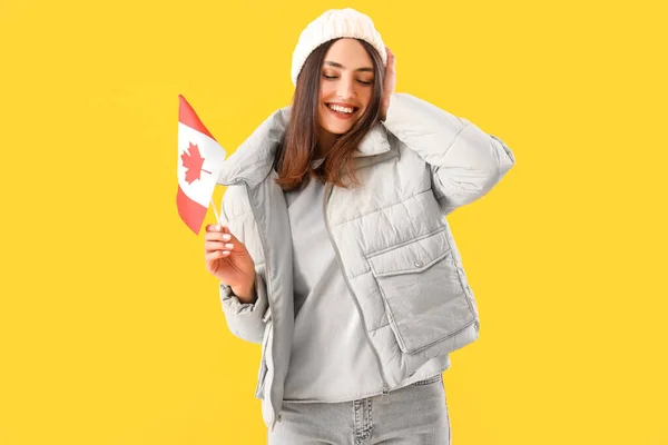 Young Woman Warm Hat Flag Canada Yellow Background — Stock Photo, Image