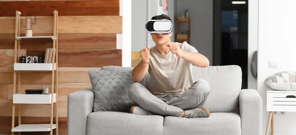 Young Man Virtual Reality Glasses Sitting Sofa Home — Stock Photo, Image