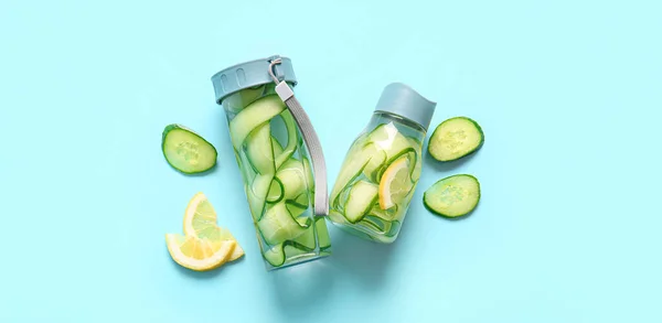 Bottles Cucumber Infused Water Light Blue Background — Stock Photo, Image