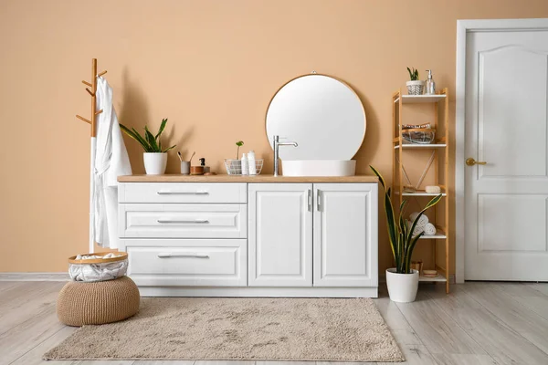 stock image Interior of bathroom with sink, mirror, shelving unit and rack