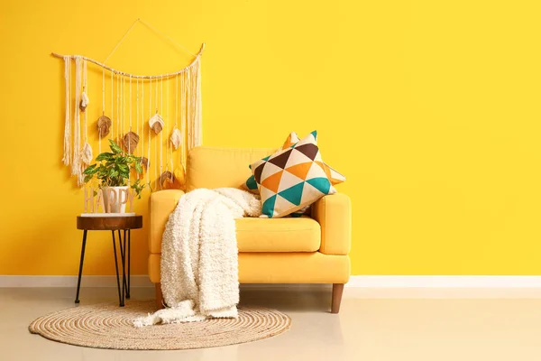 Cozy Armchair Plaid Houseplant Coffee Table Yellow Wall — Stock Photo, Image