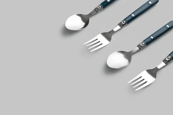Stylish Forks Spoons Grey Background — Stock Photo, Image