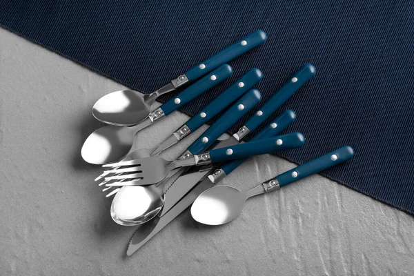 Stainless Steel Set Cutlery Blue Handles Grey Background — Stock Photo, Image