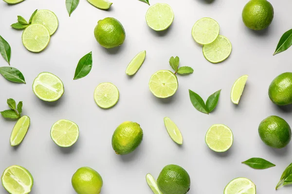 Slices Fresh Lime Mint Leaves Grey Background — Stock Photo, Image
