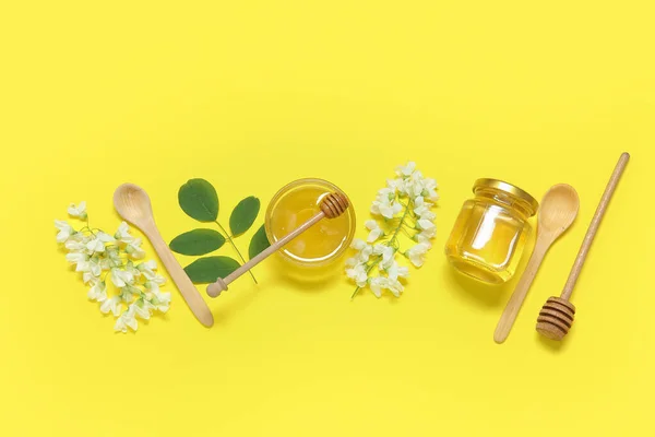 stock image Composition with sweet honey and acacia flowers on yellow background