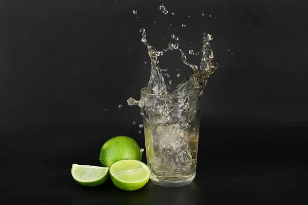 Glass Cider Splashes Ice Cube Lime Black Background — Stock Photo, Image