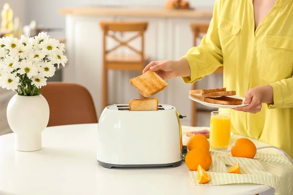 Woman Taking Crispy Bread Slice Modern Toaster Table Oranges Juice — Stock Photo, Image