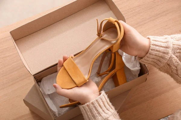 Woman Taking Out Yellow Suede Shoes Box Room — Stock Photo, Image