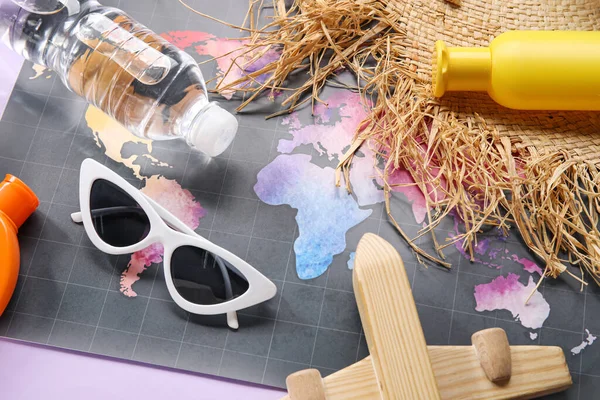 Composition World Map Bottle Sunscreen Cream Sunglasses Wooden Plane Purple — Stock Photo, Image