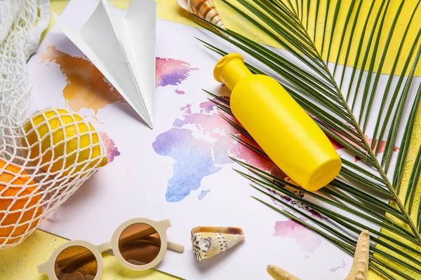 Composition World Map Bottle Sunscreen Cream Paper Plane Seashells Yellow — Stock Photo, Image