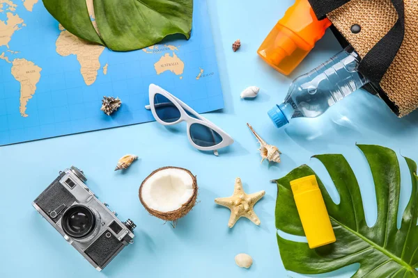 Composition World Map Bottle Sunscreen Cream Sunglasses Coconut Seashells Blue — Stock Photo, Image
