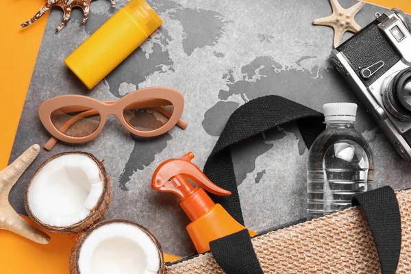 Composition World Map Bottles Sunscreen Cream Sunglasses Coconut Orange Background — Stock Photo, Image