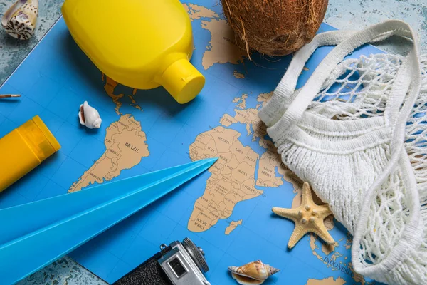 Composition World Map Bottle Sunscreen Cream Paper Plane Seashells Closeup — Stock Photo, Image