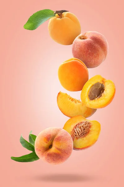 Flying Apricots Peaches Pink Background — Stock Photo, Image