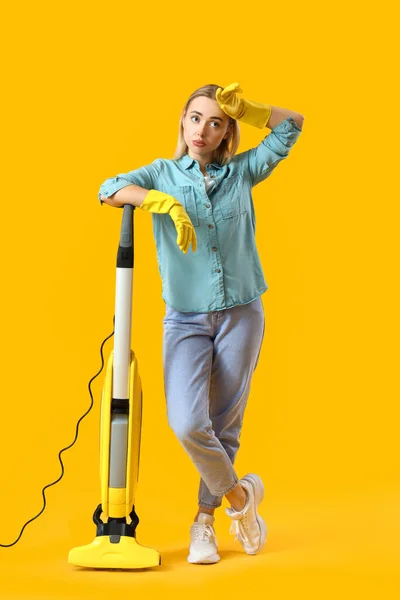 Tired Young Woman Vacuum Cleaner Yellow Background — Stock Photo, Image