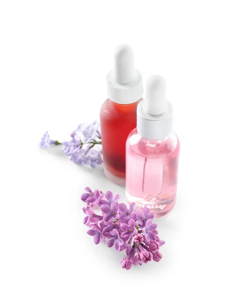 Bottles Cosmetic Oil Beautiful Lilac Flowers White Background — Stock Photo, Image