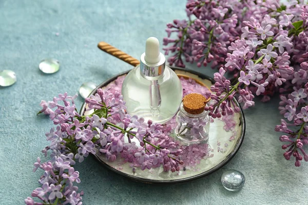 Bottles Cosmetic Oil Beautiful Lilac Flowers Sea Salt Blue Table — Stock Photo, Image