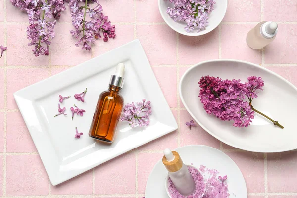 Composition Bottles Lilac Essential Oil Sea Salt Flowers Pink Background — Stock Photo, Image