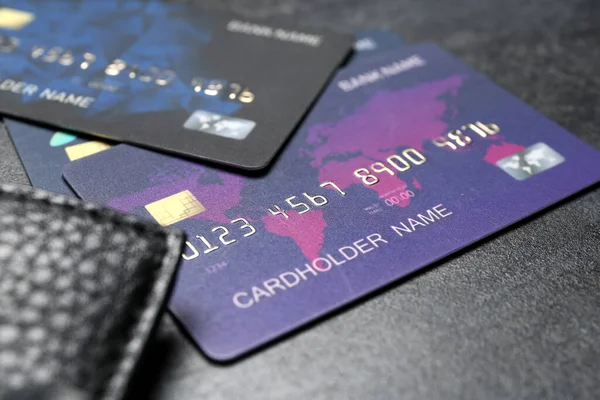 Credit cards with wallet on black grunge table