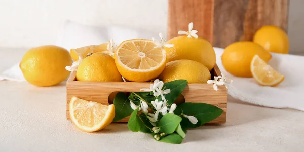 Wooden Box Lemons Blooming Branch White Table — Stock Photo, Image