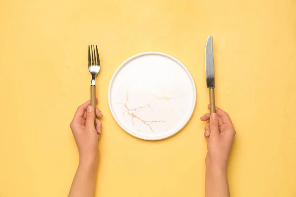 Female Hands Empty Plate Cutlery Yellow Background — Stock Photo, Image