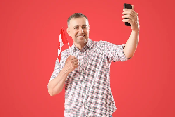 Mature Man Flag Canada Taking Selfie Red Background — Stock Photo, Image