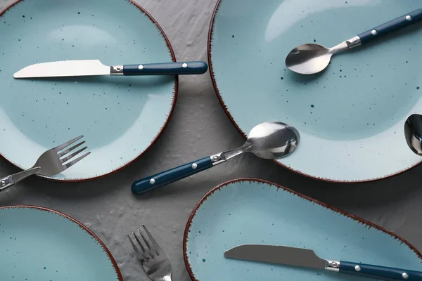 Silver Cutlery Blue Plates Grey Table — Stock Photo, Image