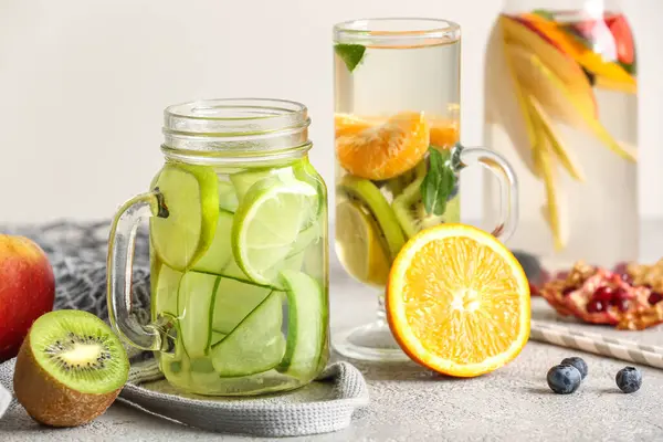 Glass Mason Jar Bottle Infused Water Different Sliced Fruits Grey — Stock Photo, Image