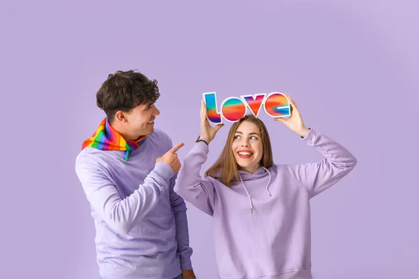 Young Couple Word Love Lilac Background Pride Month — Stock Photo, Image