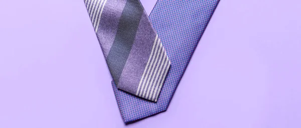 Stylish Neckties Lilac Background Top View — Stock Photo, Image