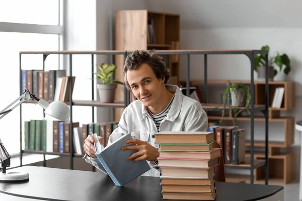Young Man Reading Book Table Library — Stock Photo, Image