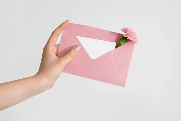 Woman Holding Envelope Blank Invitation Card Carnation Flower White Background — Stock Photo, Image