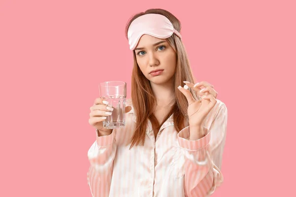Upset Young Woman Pajamas Pill Glass Water Pink Background — Stock Photo, Image
