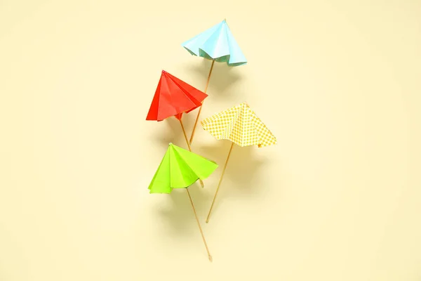 Different Mini Umbrellas Pale Yellow Background — Stock Photo, Image