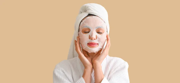 Young Woman Applied Sheet Facial Mask Beige Background — Stock Photo, Image