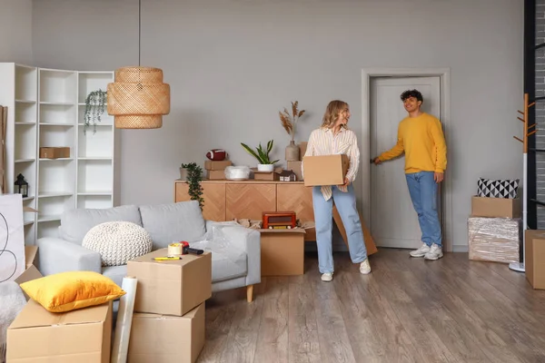 Young couple in room on moving day