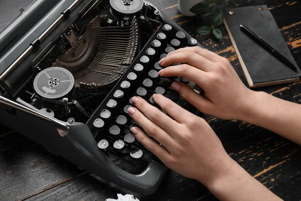 Woman Typing Typewriter Notebook Pen Houseplant Dark Wooden Background — Stock Photo, Image