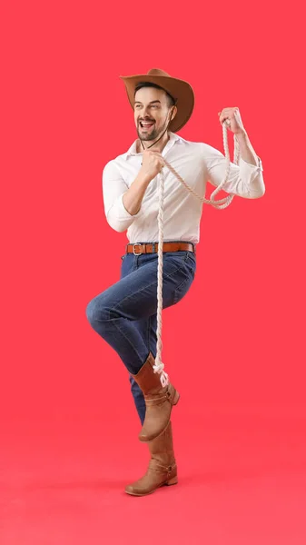 Handsome Cowboy Lasso Red Background — Stock Photo, Image